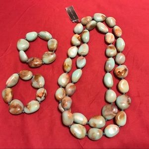 Brand new bead necklace and two bracelets.
